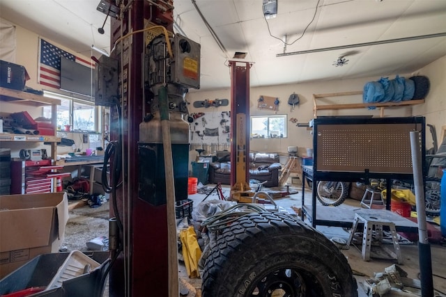 701 E Lewis St, East Helena, MT 59635 - miscellaneous room featuring healthy amount of natural light, a workshop area, and a garage