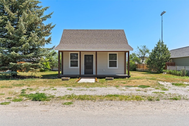 324 N Pine St, Townsend, MT 59644 - bungalow featuring a porch and a shingled roof