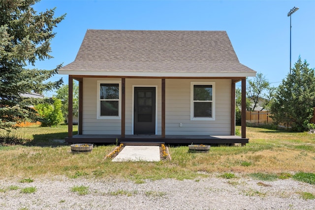324 N Pine St, Townsend, MT 59644 - bungalow-style house featuring a porch and a shingled roof