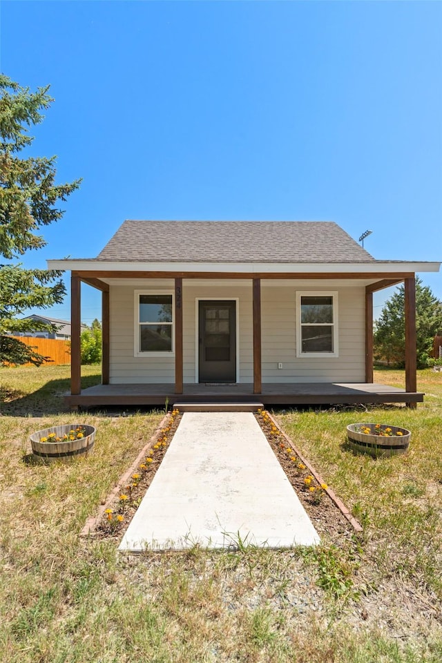 324 N Pine St, Townsend, MT 59644 - bungalow-style home with a front yard and covered porch