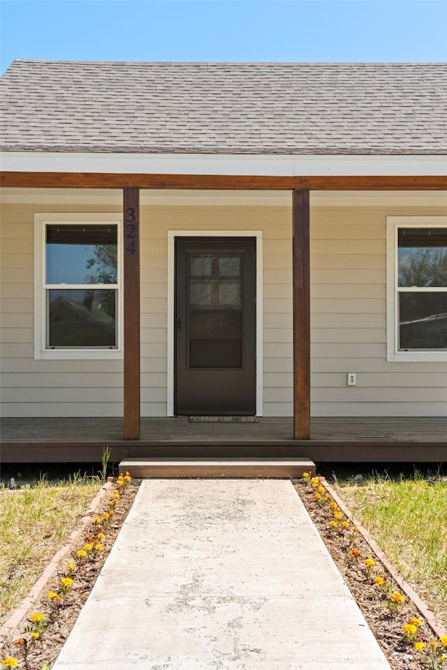 324 N Pine St, Townsend, MT 59644 - view of exterior entry with covered porch and roof with shingles