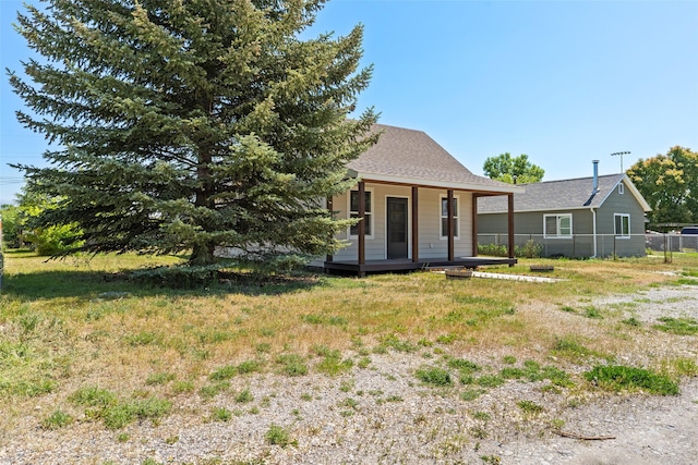 324 N Pine St, Townsend, MT 59644 - rear view of property featuring a porch and roof with shingles