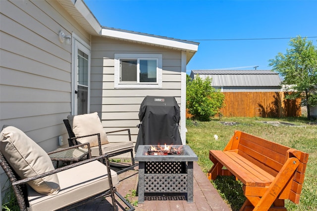 324 N Pine St, Townsend, MT 59644 - wooden terrace featuring an outdoor fire pit and area for grilling