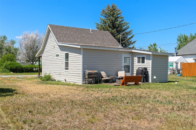 324 N Pine St, Townsend, MT 59644 - back of house featuring a yard and roof with shingles