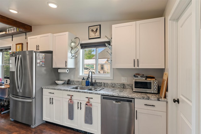 324 N Pine St, Townsend, MT 59644 - kitchen with stainless steel appliances, dark wood-type flooring, white cabinets, beam ceiling, and light stone counters