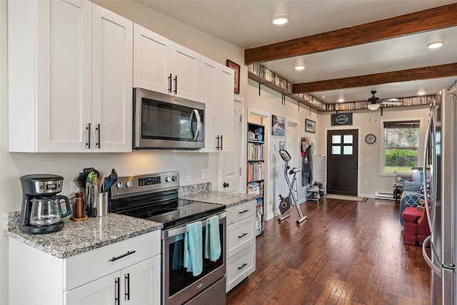 324 N Pine St, Townsend, MT 59644 - kitchen with stainless steel appliances, a ceiling fan, white cabinets, dark wood-style flooring, and light stone countertops