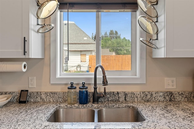 324 N Pine St, Townsend, MT 59644 - kitchen view of white cabinets and light stone counters