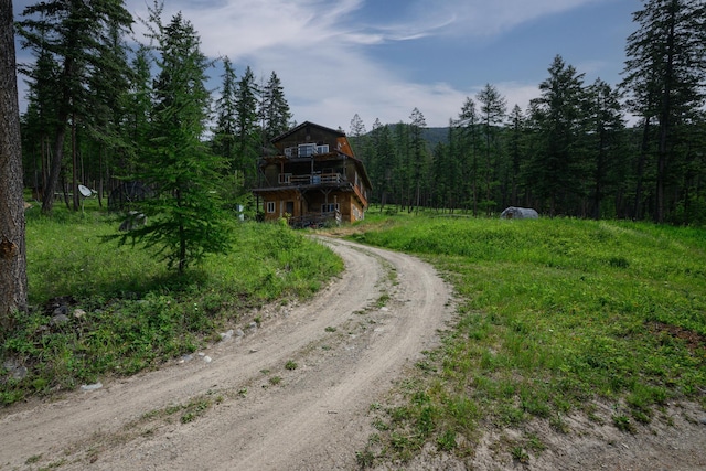 456 Gould Rd, Eureka, MT 59917 - view of dirt / gravel road with a forest view