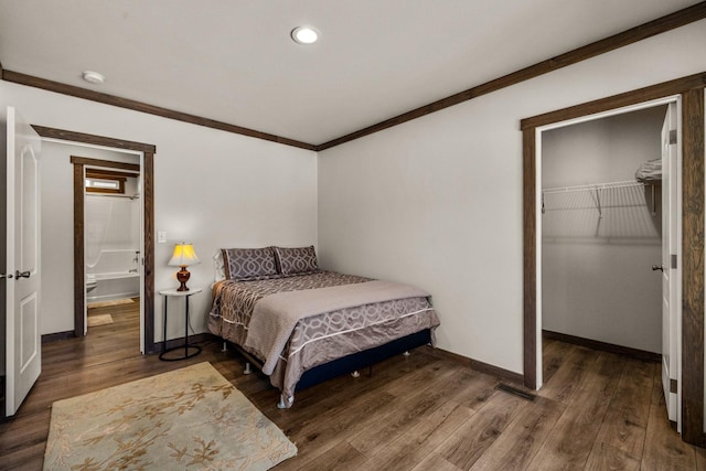 4475 Star Meadows Rd, Whitefish, MT 59937 - bedroom with wood finished floors, crown molding, recessed lighting, a walk in closet, and a closet