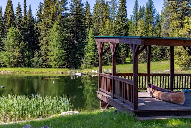 4475 Star Meadows Rd, Whitefish, MT 59937 - wooden terrace featuring a water view and a forest view