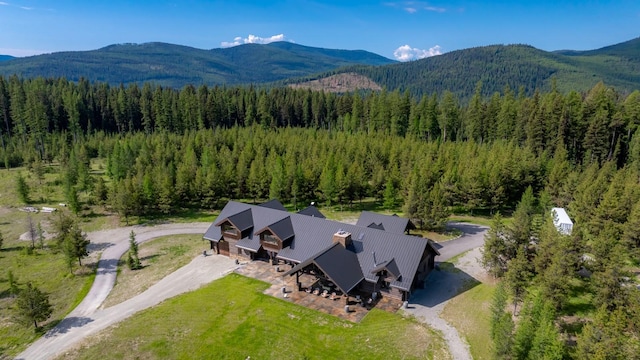 4475 Star Meadows Rd, Whitefish, MT 59937 - view of subject property with a heavily wooded area and a mountain backdrop