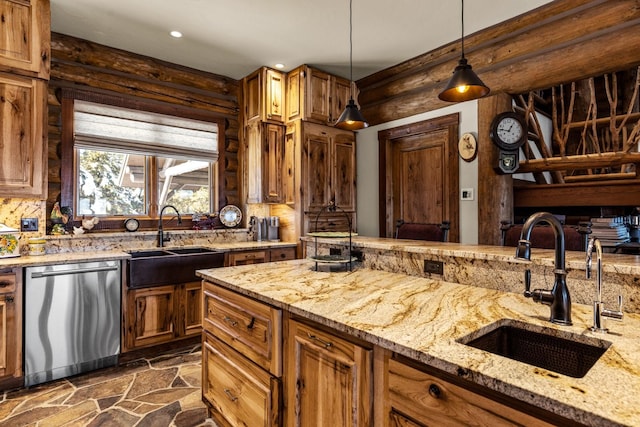 4475 Star Meadows Rd, Whitefish, MT 59937 - kitchen with stainless steel dishwasher, dark stone finish floors, recessed lighting, hanging light fixtures, and brown cabinetry