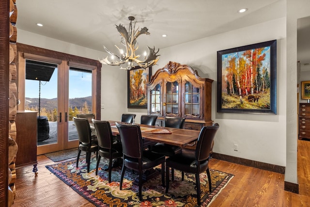 4475 Star Meadows Rd, Whitefish, MT 59937 - dining space featuring a chandelier, wood finished floors, recessed lighting, and french doors