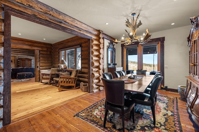 4475 Star Meadows Rd, Whitefish, MT 59937 - dining area with a chandelier, rustic walls, hardwood / wood-style flooring, and recessed lighting