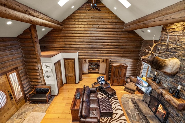 4475 Star Meadows Rd, Whitefish, MT 59937 - living area featuring recessed lighting, light wood-type flooring, high vaulted ceiling, a skylight, and rustic walls