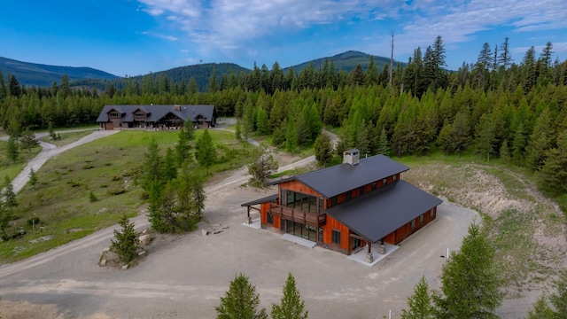 4475 Star Meadows Rd, Whitefish, MT 59937 - view from above of property featuring a mountainous background and a heavily wooded area