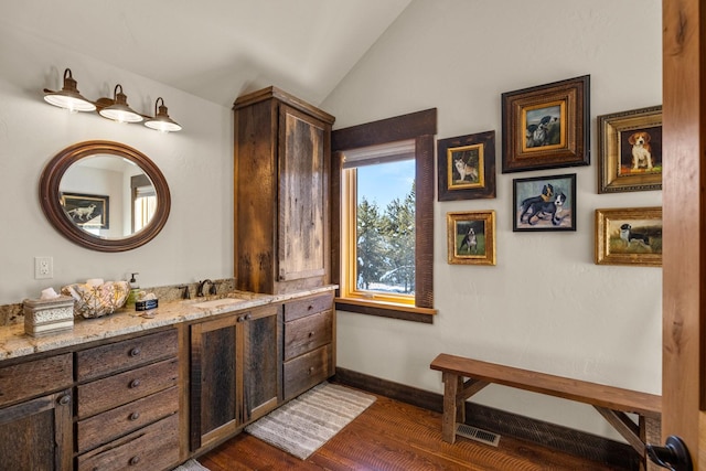 4475 Star Meadows Rd, Whitefish, MT 59937 - bathroom featuring vaulted ceiling, vanity, and wood finished floors