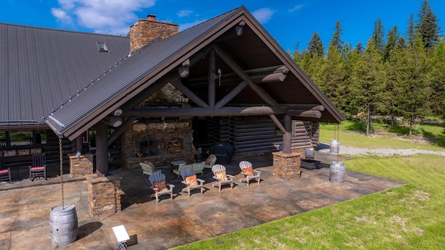 4475 Star Meadows Rd, Whitefish, MT 59937 - view of patio / terrace with an outdoor stone fireplace