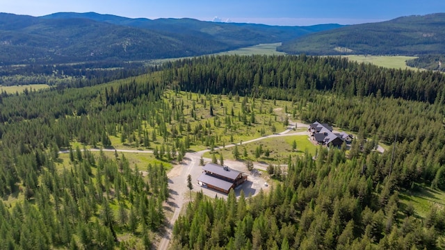 4475 Star Meadows Rd, Whitefish, MT 59937 - aerial view of a heavily wooded area and a mountainous background