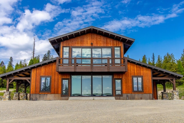 4475 Star Meadows Rd, Whitefish, MT 59937 - rear view of house with dirt driveway