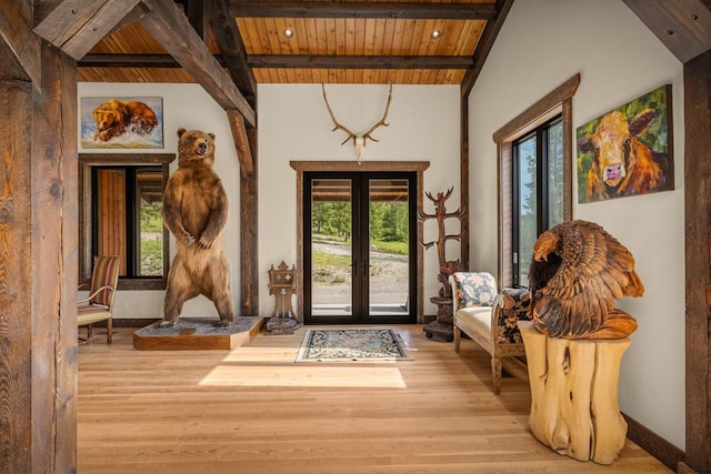 4475 Star Meadows Rd, Whitefish, MT 59937 - foyer entrance featuring a wooden ceiling with exposed beams, wood finished floors, and french doors