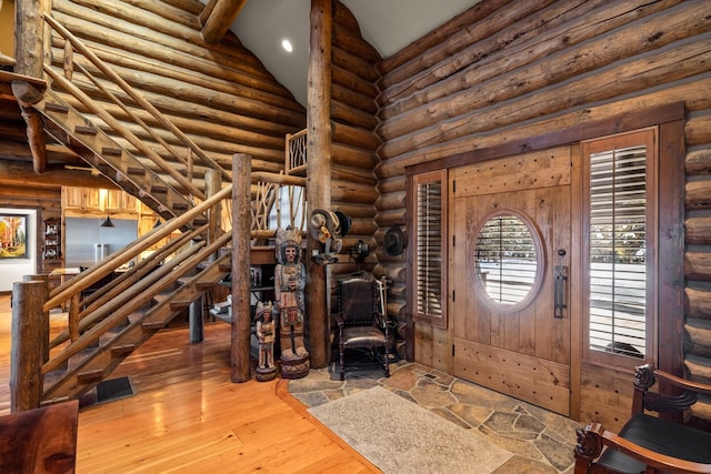 4475 Star Meadows Rd, Whitefish, MT 59937 - entryway featuring rustic walls, hardwood / wood-style floors, vaulted ceiling, stairway, and recessed lighting