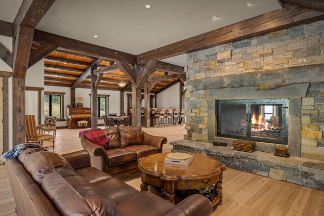 4475 Star Meadows Rd, Whitefish, MT 59937 - living room with wood finished floors, a stone fireplace, and recessed lighting