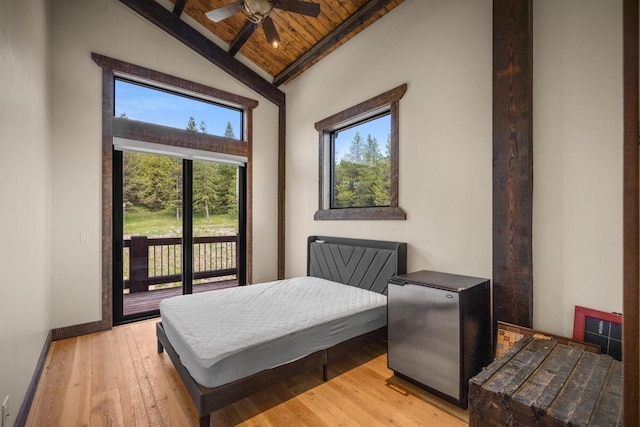 4475 Star Meadows Rd, Whitefish, MT 59937 - bedroom featuring access to outside, a wooden ceiling with exposed beams, multiple windows, light wood-style floors, and high vaulted ceiling