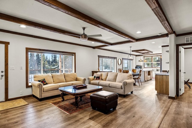 4475 Star Meadows Rd, Whitefish, MT 59937 - living room featuring light wood finished floors, ceiling fan, beam ceiling, ornamental molding, and recessed lighting