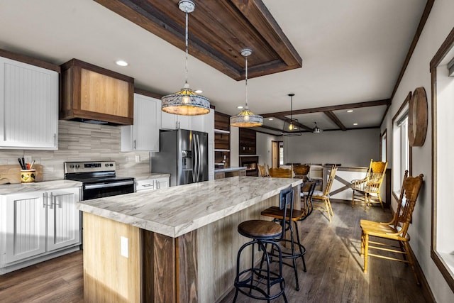 4475 Star Meadows Rd, Whitefish, MT 59937 - kitchen featuring stainless steel appliances, a center island, premium range hood, dark wood-style floors, and backsplash