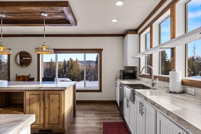 4475 Star Meadows Rd, Whitefish, MT 59937 - kitchen with light countertops, dark wood-style floors, white cabinetry, hanging light fixtures, and recessed lighting