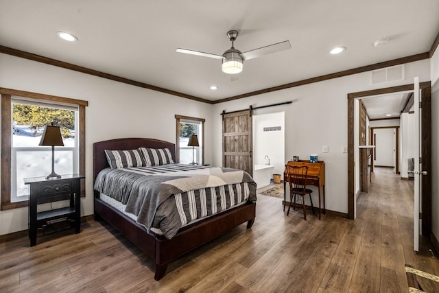 4475 Star Meadows Rd, Whitefish, MT 59937 - bedroom with ornamental molding, wood finished floors, a barn door, recessed lighting, and a ceiling fan