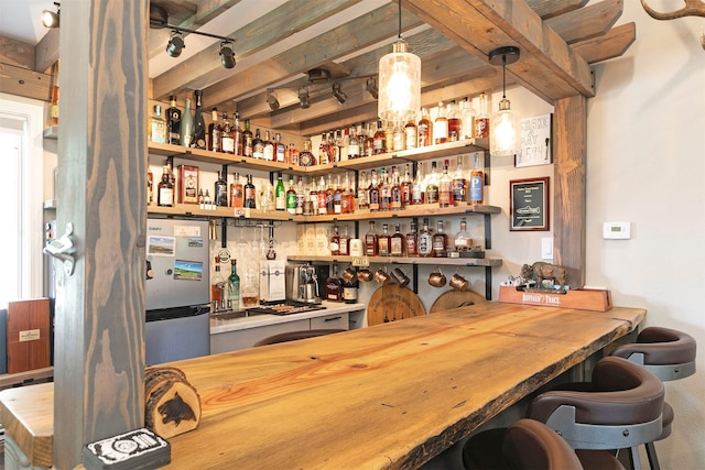 108 Apple House Ln, Missoula, MT 59802 - indoor dry bar featuring freestanding refrigerator and pendant lighting