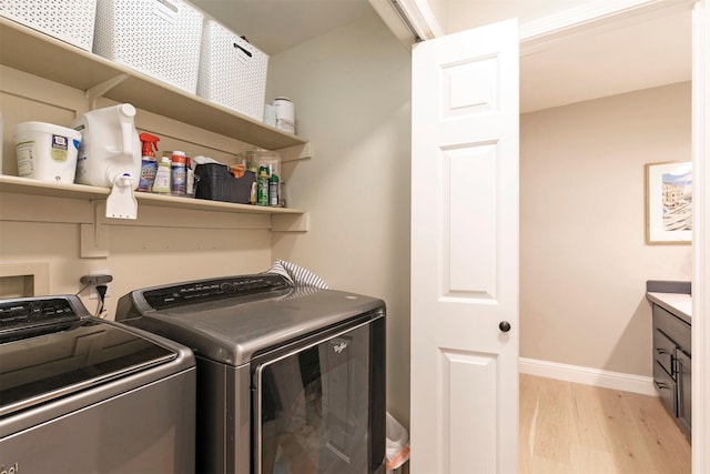 108 Apple House Ln, Missoula, MT 59802 - laundry area featuring washer and dryer and light wood finished floors