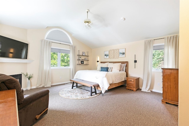 108 Apple House Ln, Missoula, MT 59802 - bedroom featuring carpet, vaulted ceiling, and a fireplace