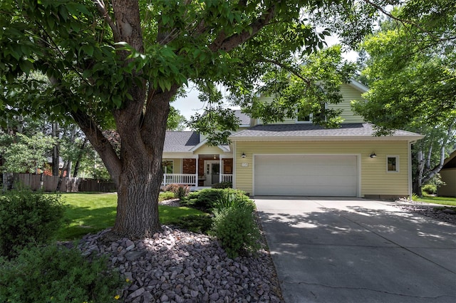 108 Apple House Ln, Missoula, MT 59802 - obstructed view of property featuring concrete driveway and a garage