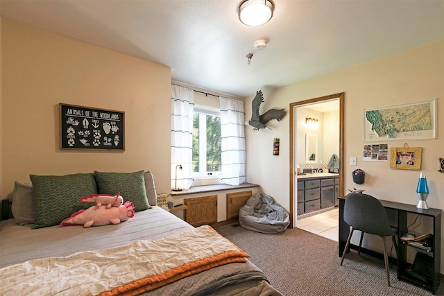 108 Apple House Ln, Missoula, MT 59802 - bedroom with light carpet, connected bathroom, and light tile patterned floors