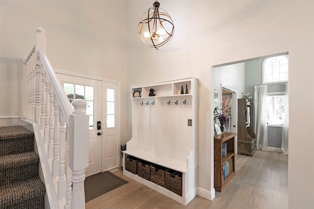 108 Apple House Ln, Missoula, MT 59802 - mudroom with a high ceiling, light wood-type flooring, and a chandelier
