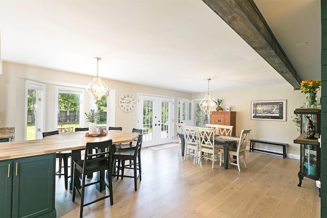 108 Apple House Ln, Missoula, MT 59802 - dining area with a chandelier, french doors, and light wood finished floors