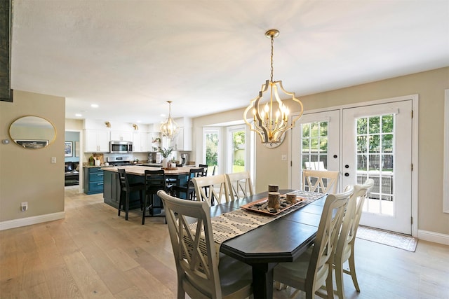 108 Apple House Ln, Missoula, MT 59802 - dining space with a chandelier, light wood-style floors, french doors, and recessed lighting