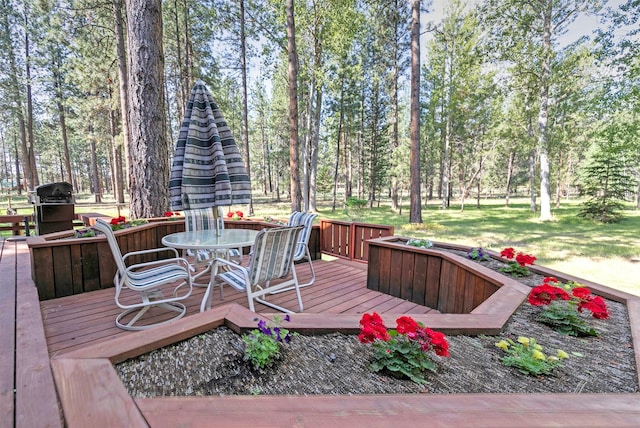 4037 Wakantanka Way, Stevensville, MT 59870 - wooden terrace with area for grilling and outdoor dining space