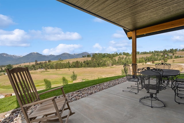 559 Stage Springs Ln, Stevensville, MT 59870 - view of patio / terrace featuring a mountain view and outdoor dining space