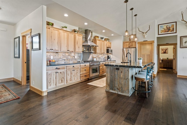 559 Stage Springs Ln, Stevensville, MT 59870 - kitchen featuring stainless steel appliances, island range hood, light brown cabinetry, dark wood finished floors, and decorative backsplash