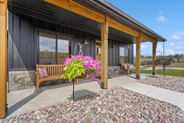 559 Stage Springs Ln, Stevensville, MT 59870 - property entrance featuring board and batten siding, stone siding, and a porch