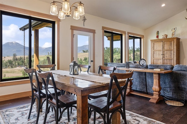 559 Stage Springs Ln, Stevensville, MT 59870 - dining room with a mountain view, dark wood-type flooring, vaulted ceiling, a chandelier, and recessed lighting