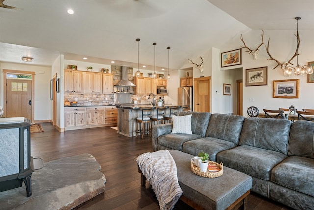 559 Stage Springs Ln, Stevensville, MT 59870 - living area with a chandelier, dark wood-style flooring, lofted ceiling, and recessed lighting