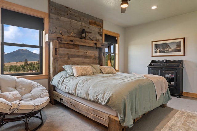 559 Stage Springs Ln, Stevensville, MT 59870 - carpeted bedroom with a ceiling fan, a mountain view, and recessed lighting