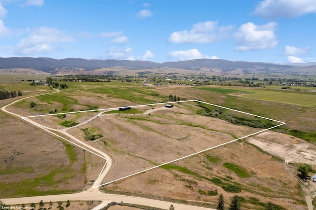 559 Stage Springs Ln, Stevensville, MT 59870 - aerial view of sparsely populated area featuring a mountain backdrop and property boundaries highlighted