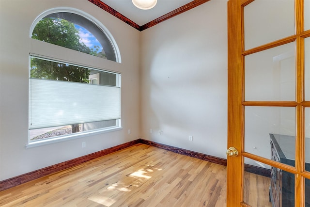 46452 Stagecoach Trl, Ronan, MT 59864 - spare room featuring plenty of natural light, ornamental molding, and wood finished floors