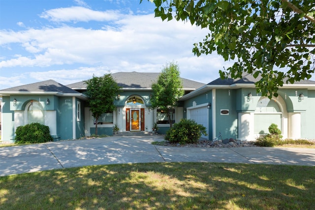 46452 Stagecoach Trl, Ronan, MT 59864 - ranch-style home featuring stucco siding and a garage
